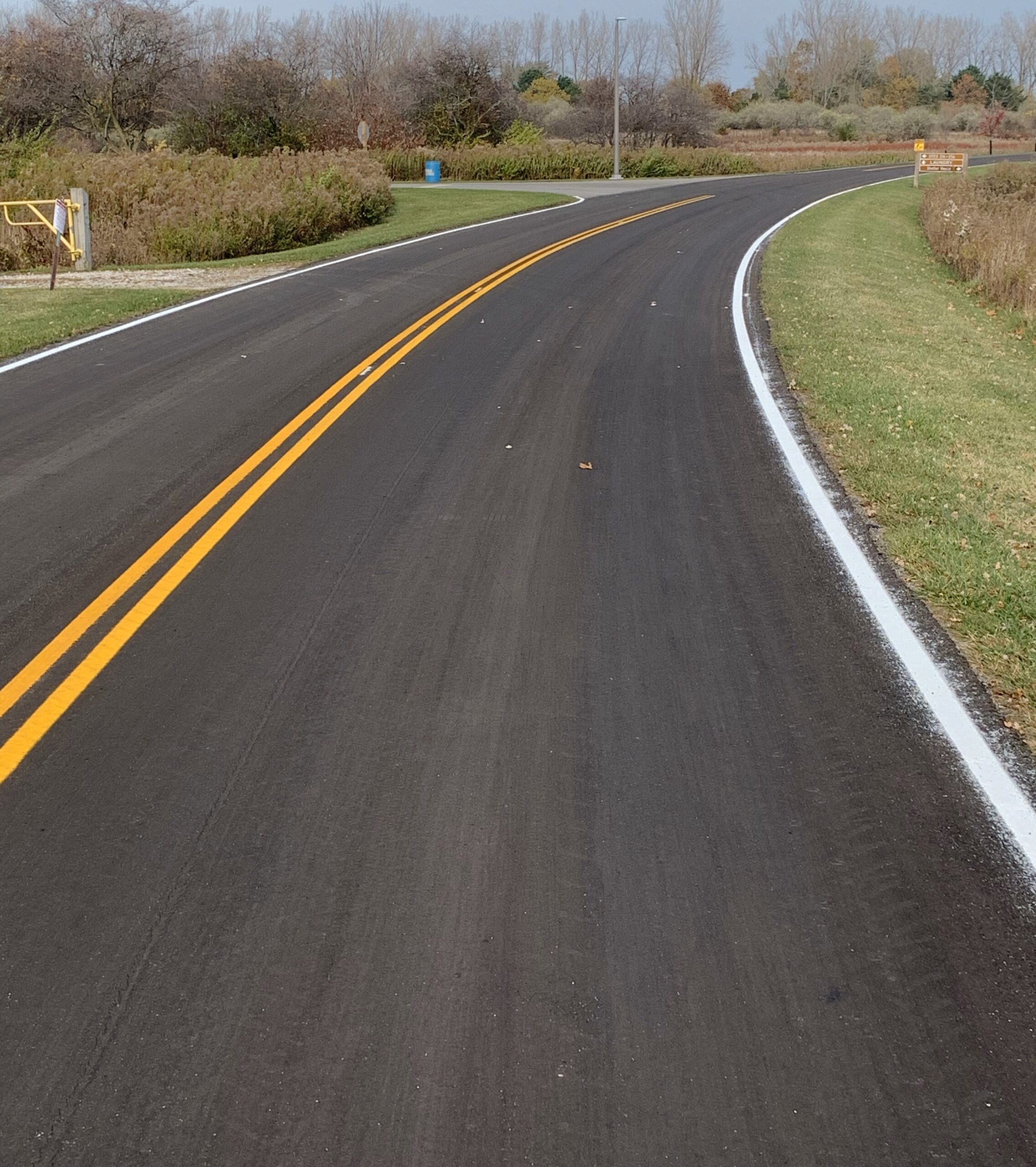 Road with cured miro surfacing treatment applied