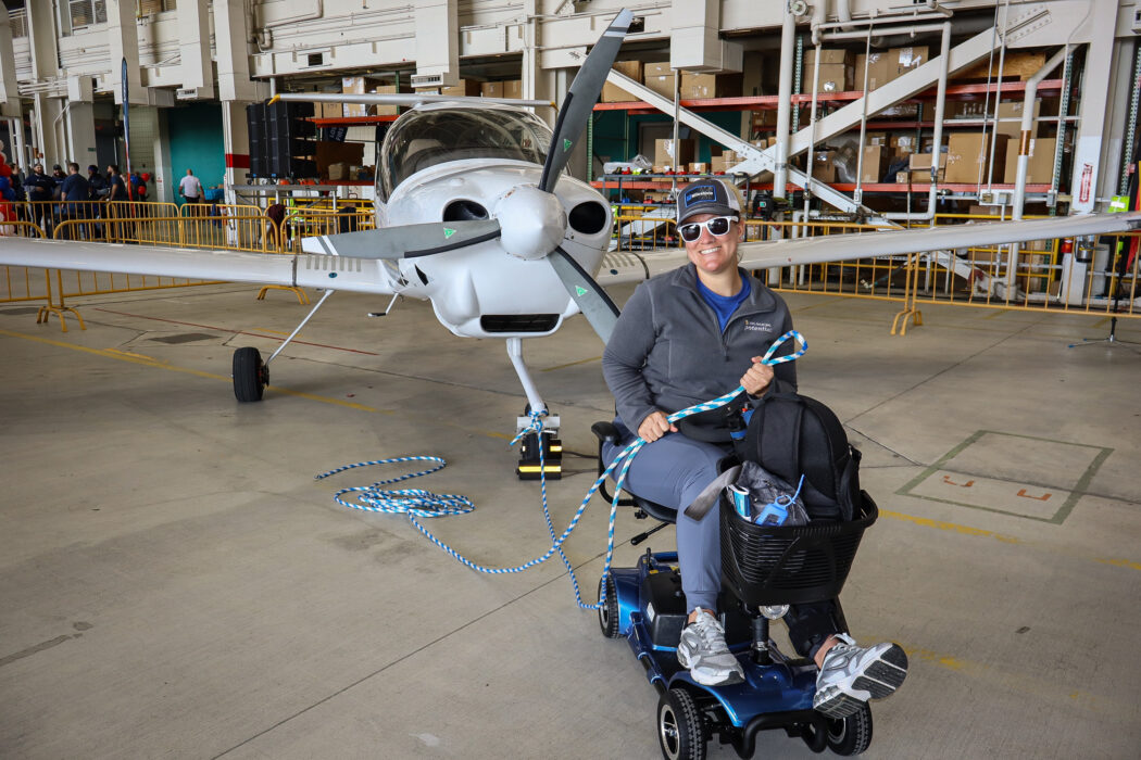 Participant in front of the plane