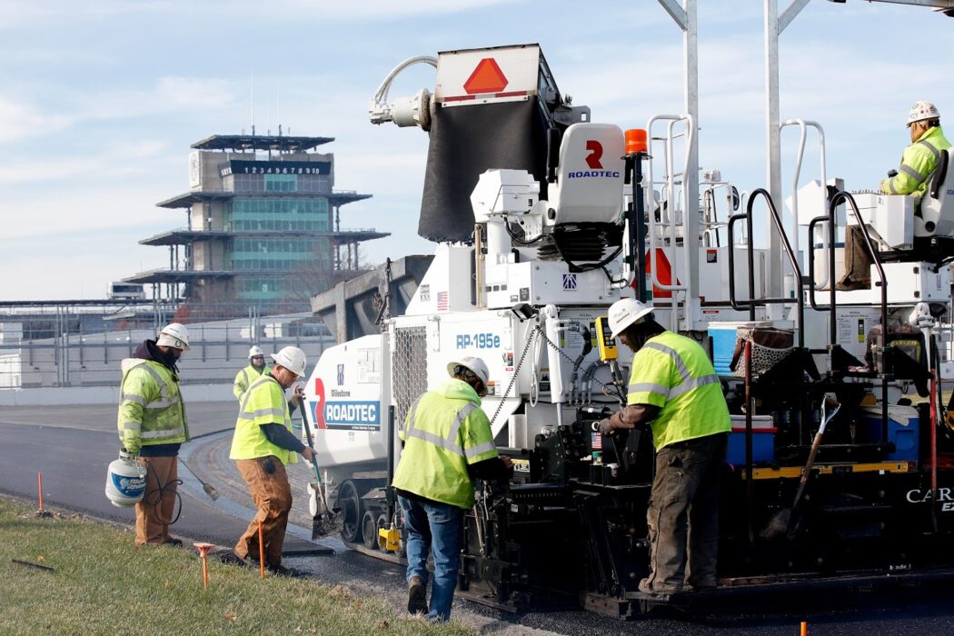 Milestone working on the IMS track with the pagoda in the background