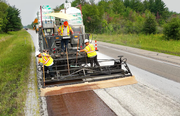 Evergreen Roadworks laying cape seal