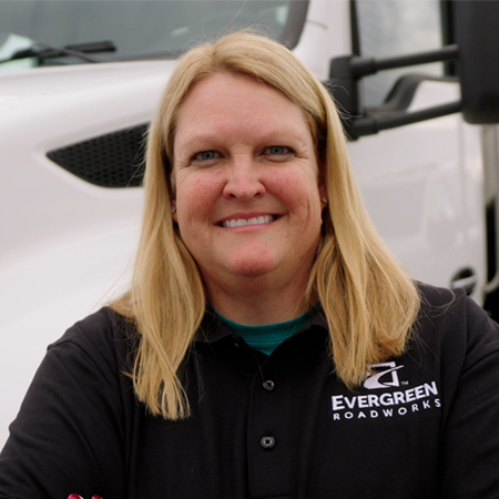 woman in front of truck