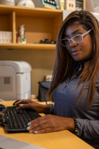Close-up of female working on her computer